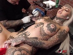 Amber Luke masturbates while getting tattooed